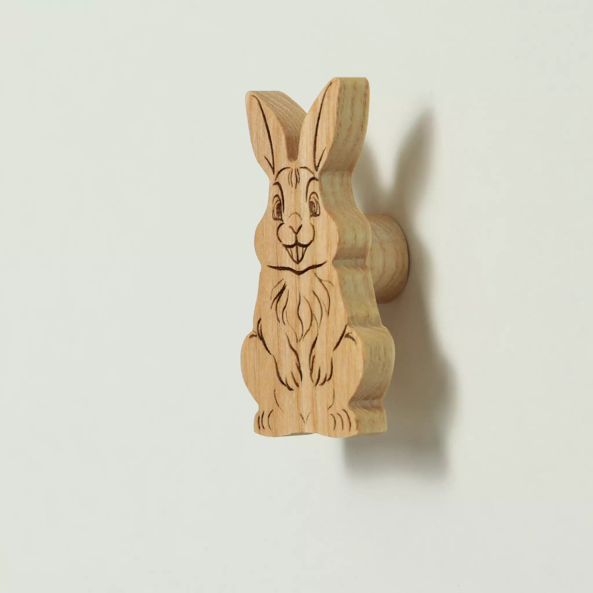 Rabbit cabinet knob in solid ash, engraved and cut to the outline of the animal