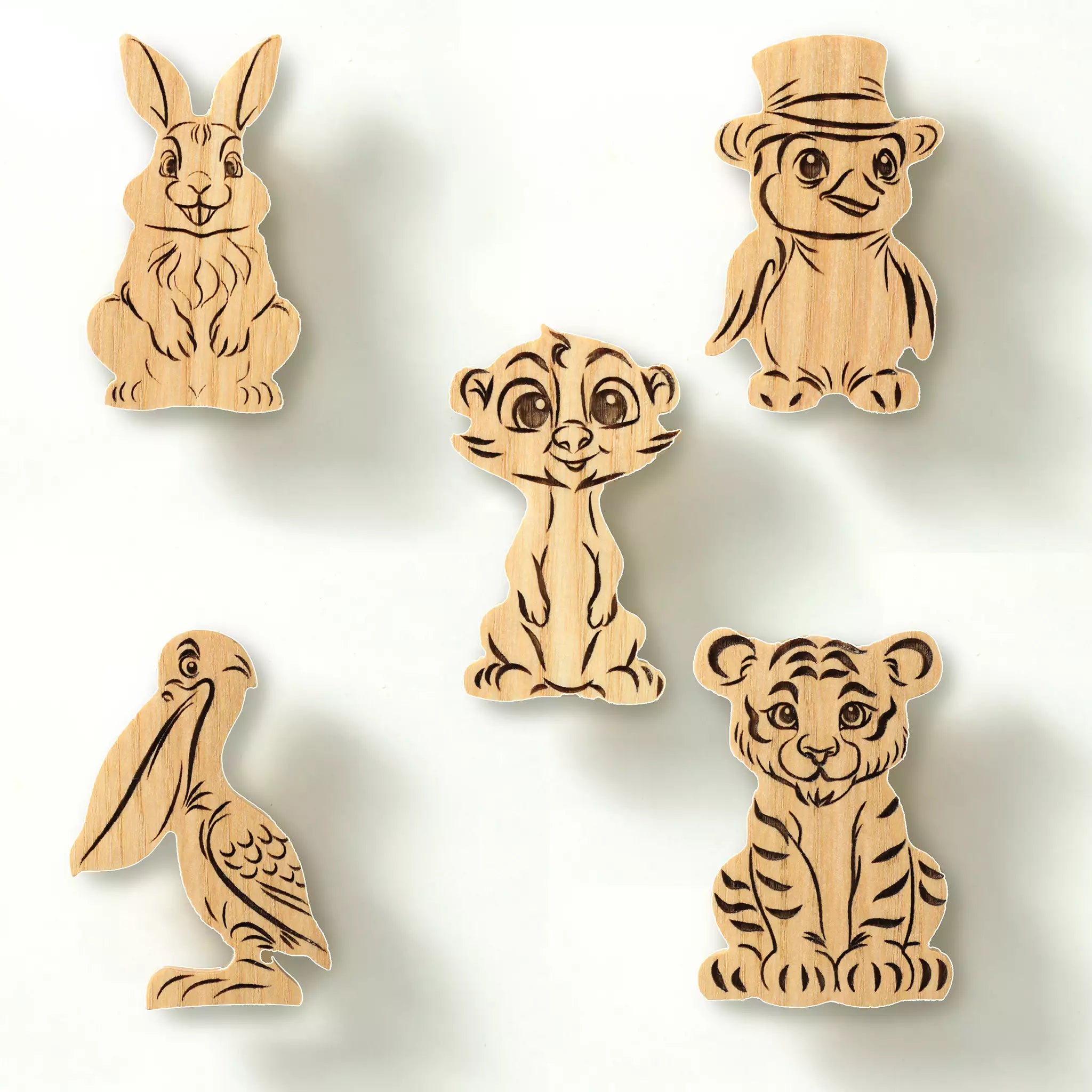 The five animal knobs in solid ash arranged on a white background