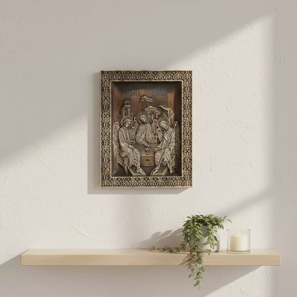 The icon hung above a floating shelf with a plant and a candle, lit from the side