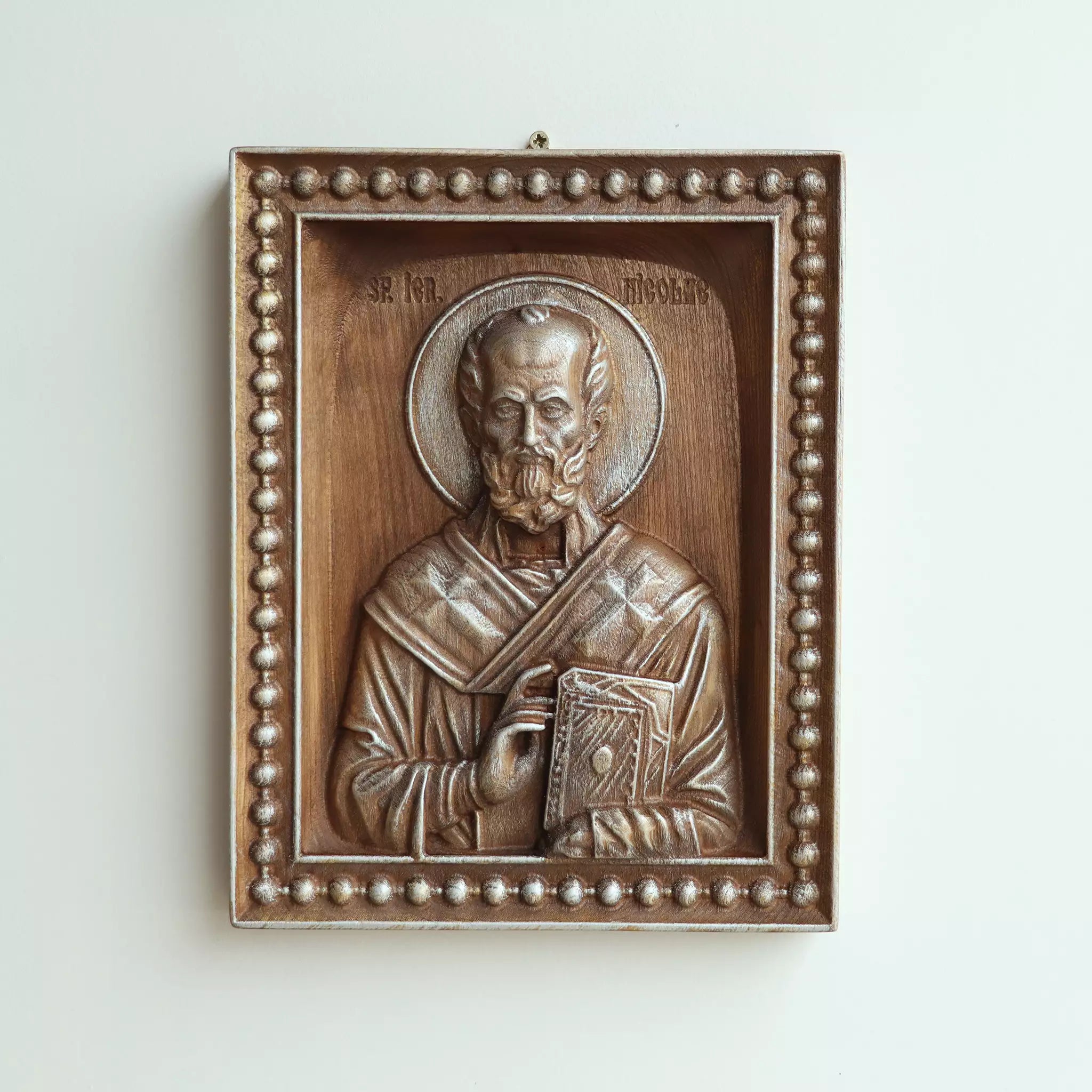 The icon hanging flat on a wall, seen straight on
