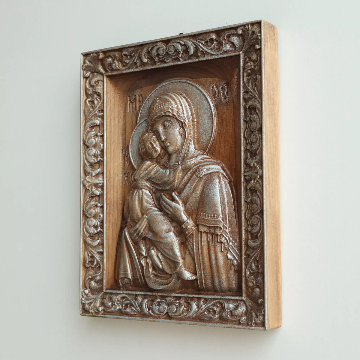 Side view of the icon, showing the thickness of the panel and the pale wood edge
