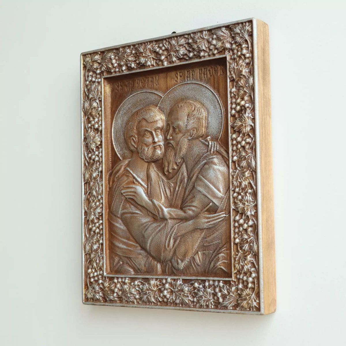Side view of the icon, showing the thickness of the panel and the pale wood edge
