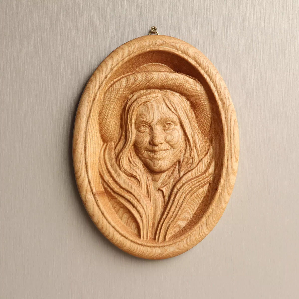 The natural oiled portrait seen straight on, showing the raised oval border