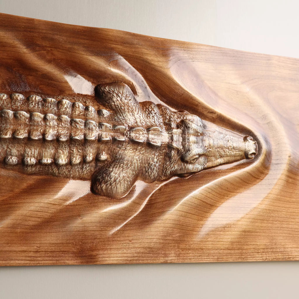 Close view of the head and front legs, cut in high relief