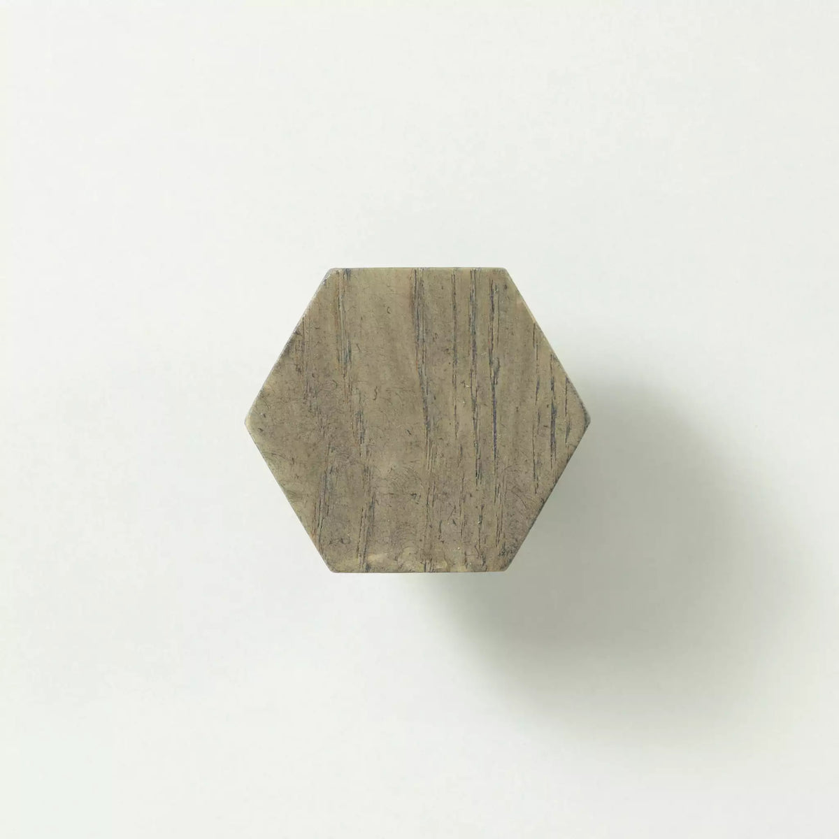 Hexagon cabinet knob in the Dark Gray finish seen from the front, showing the flat face
