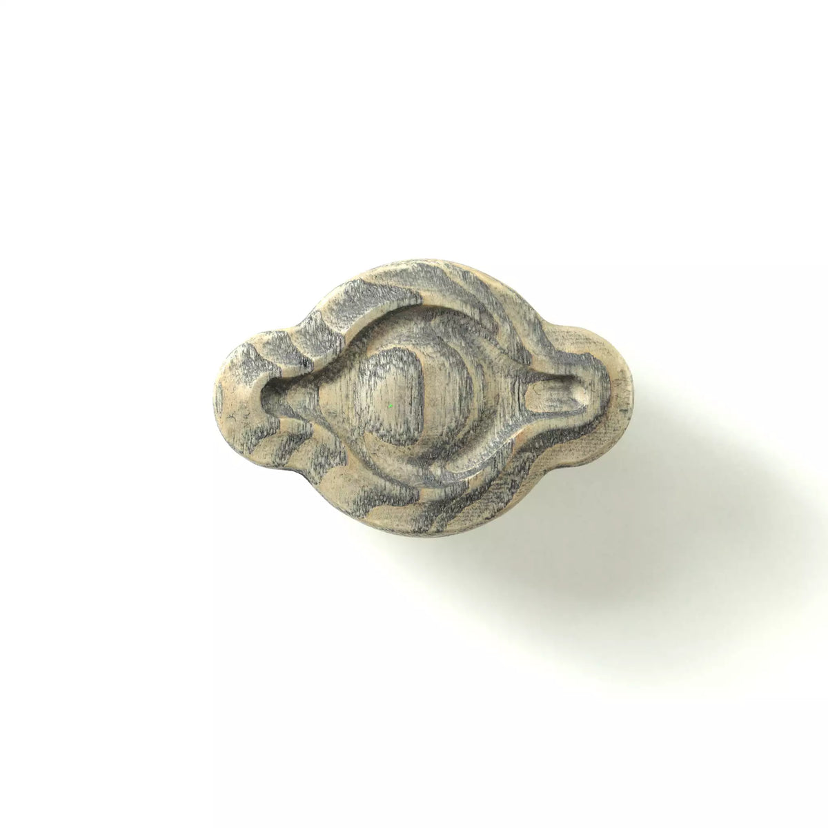 Petal cabinet knob in the Dark Gray finish on a white background, showing the carved groove