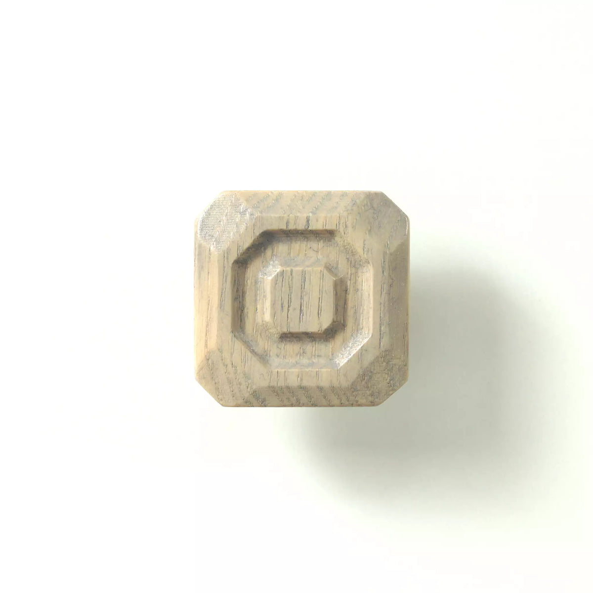 Stepped octagon cabinet knob in the Dark Gray finish on a white background, showing the three tiers