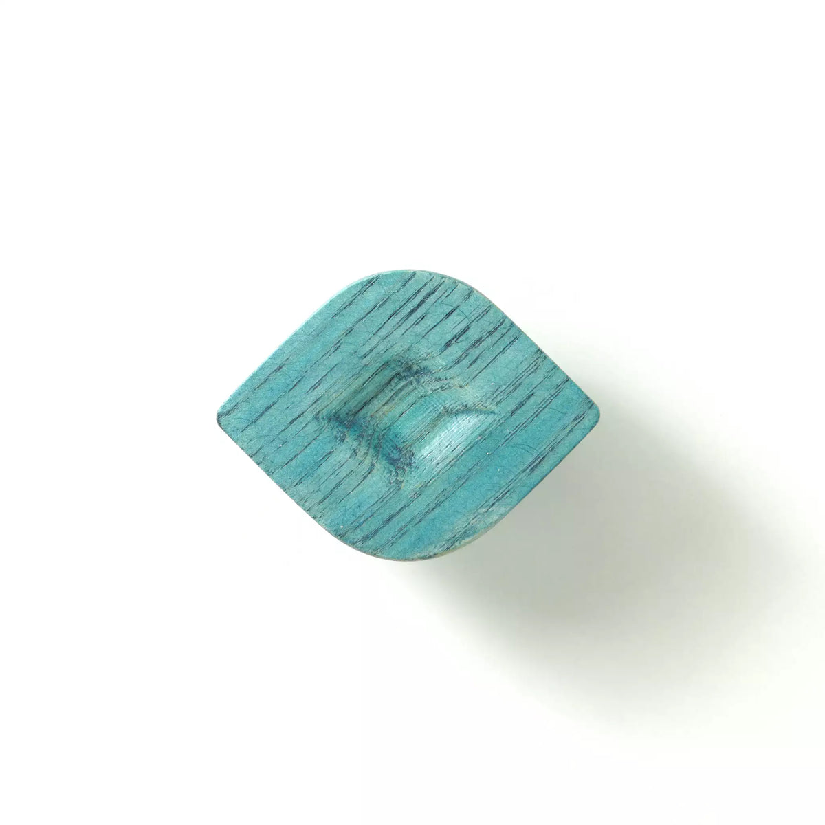 Twist cabinet knob in the Blue finish on a white background, showing the carved hollow