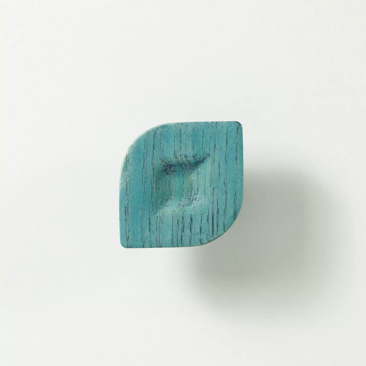 Twist cabinet knob in the Blue finish seen from the front, showing the two pointed corners