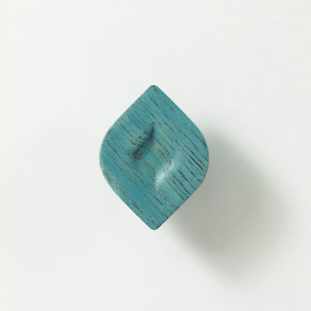 Twist cabinet knob in the Blue finish seen at an angle, showing the twisted outline