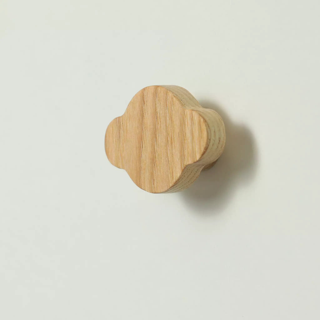 Cloud-shaped ash cabinet knob in Blue, seen at an angle