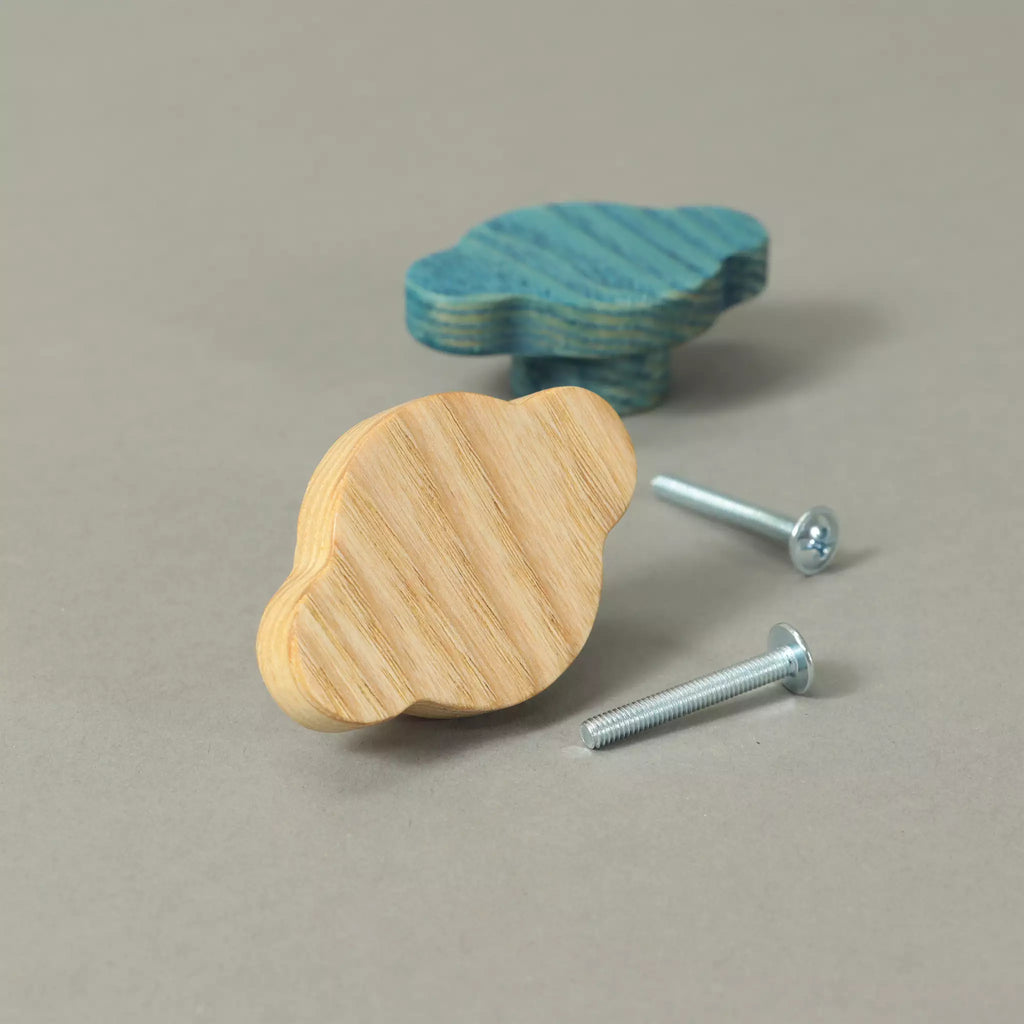 Two cloud-shaped ash cabinet knobs with their mounting screws, one shown from the back with the threaded metal insert visible in the base