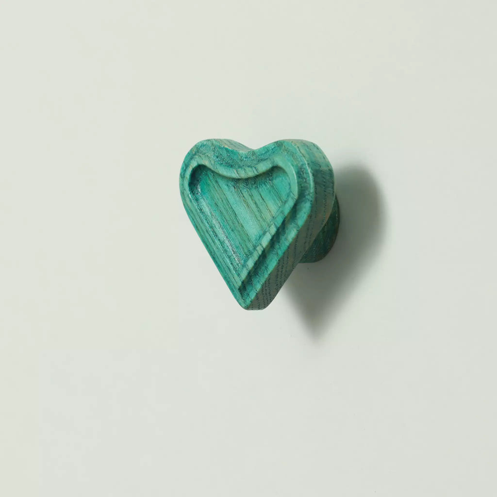 Heart cabinet knob in the Green finish seen from the front with the base visible behind it
