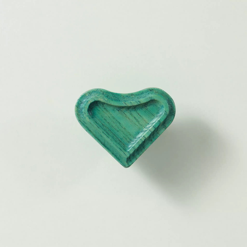 Heart cabinet knob in the Green finish seen at an angle, showing the recessed face