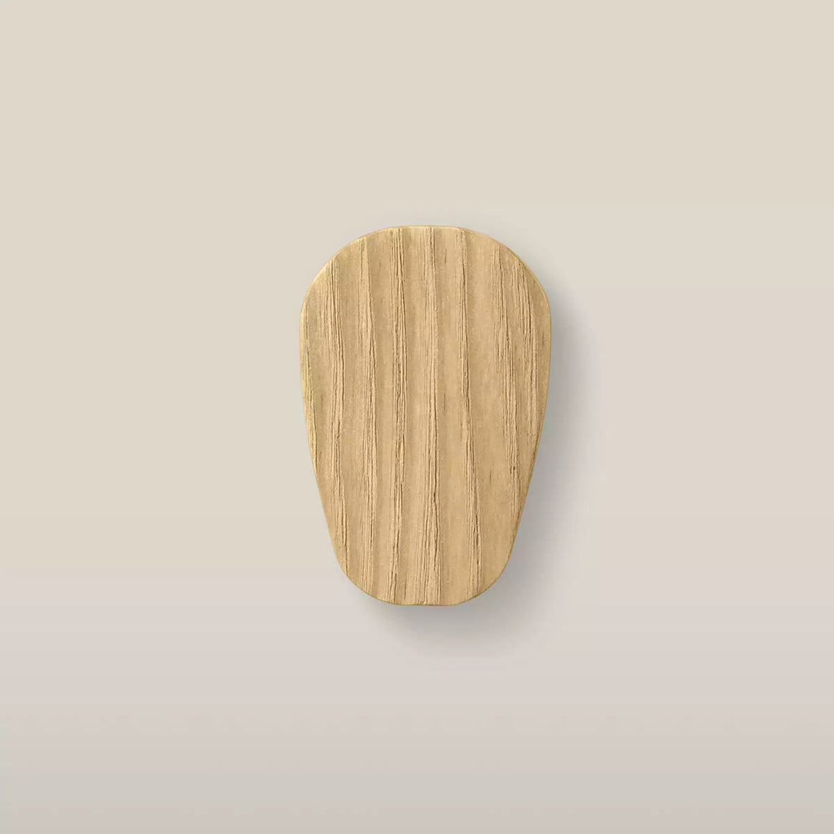 Solid ash pebble cabinet knob in the Oiled finish, front view