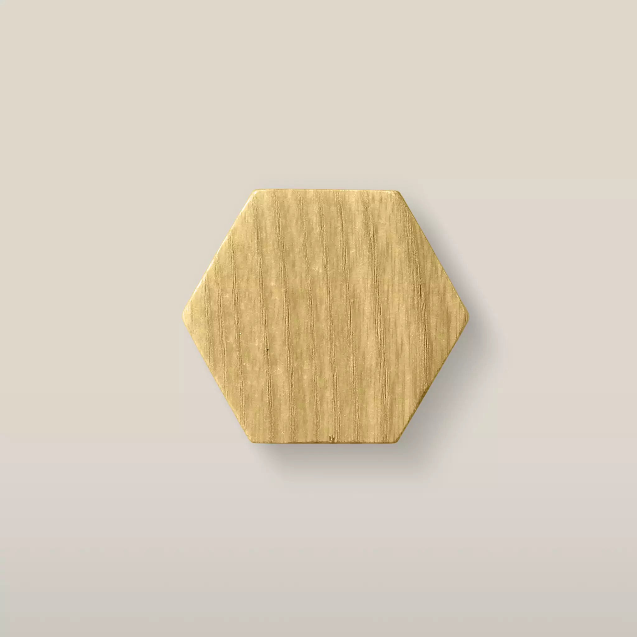 Solid ash hexagon cabinet knob in the Cream finish, front view