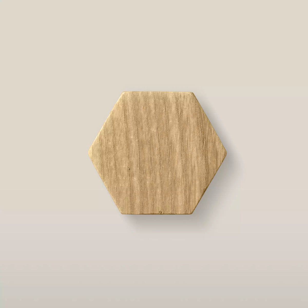 Solid ash hexagon cabinet knob in the Oiled finish, front view
