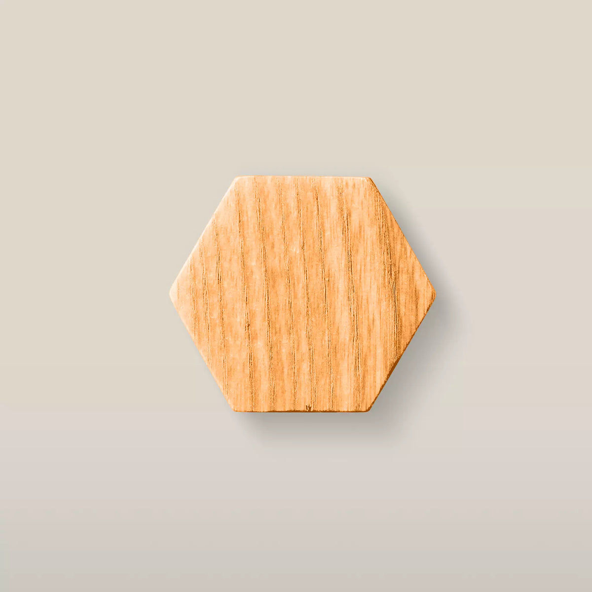 Solid ash hexagon cabinet knob in the Orange finish, front view