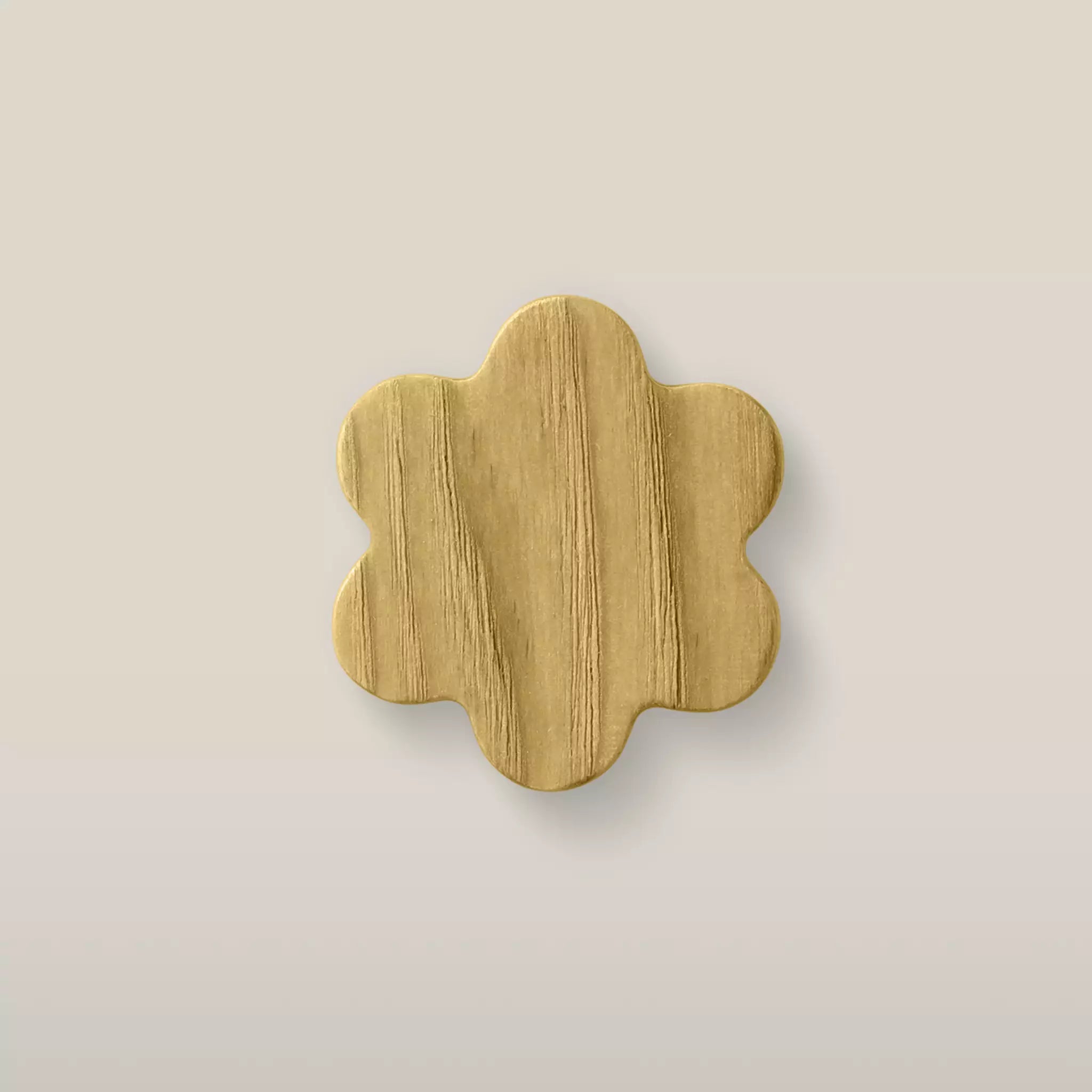 Solid ash flower cabinet knob in the Cream finish, front view