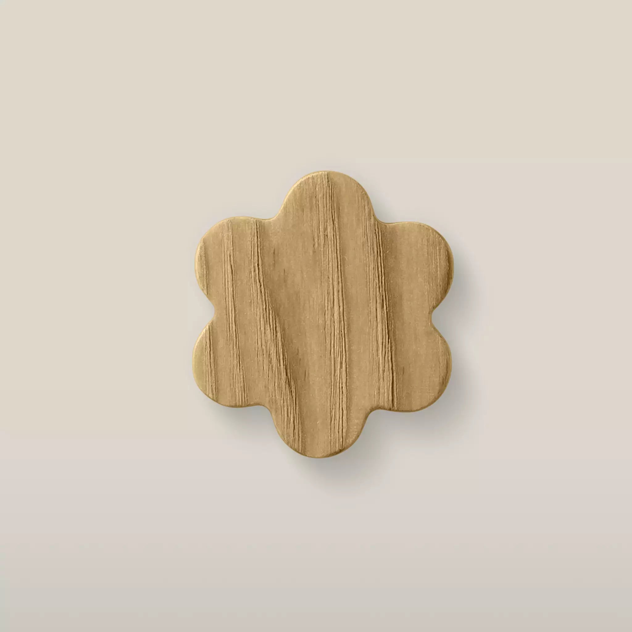 Solid ash flower cabinet knob in the Oiled finish, front view