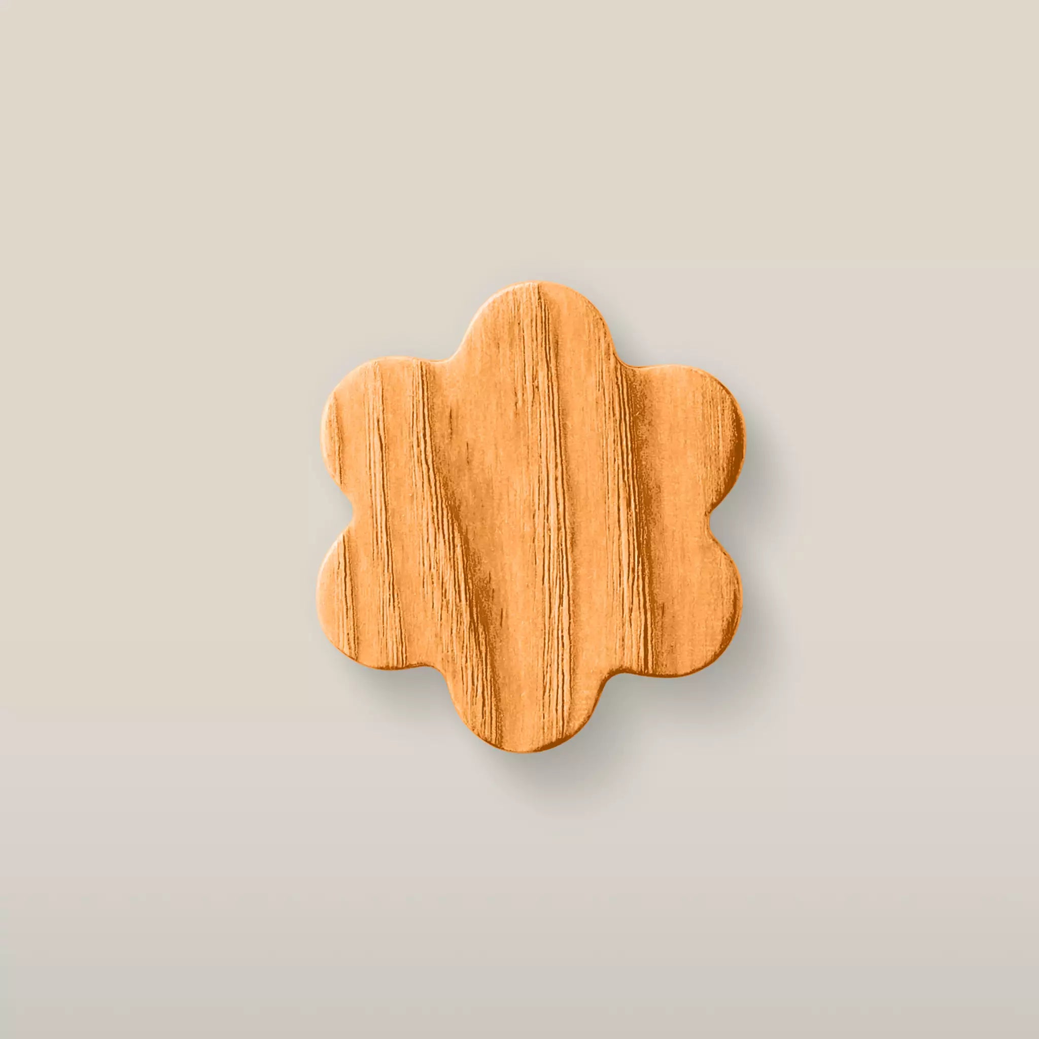 Solid ash flower cabinet knob in the Orange finish, front view