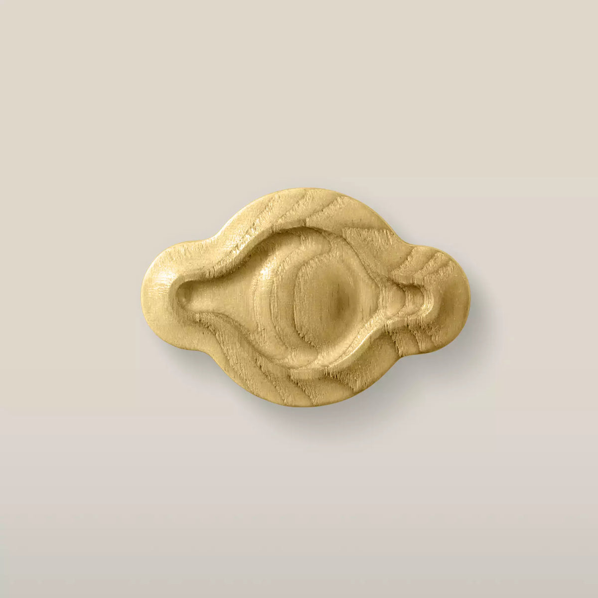 Solid ash petal cabinet knob in the Cream finish, front view