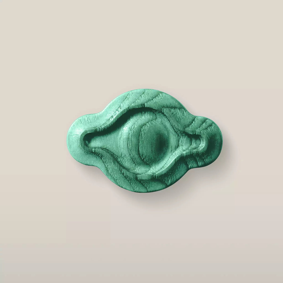 Solid ash petal cabinet knob in the Green finish, front view
