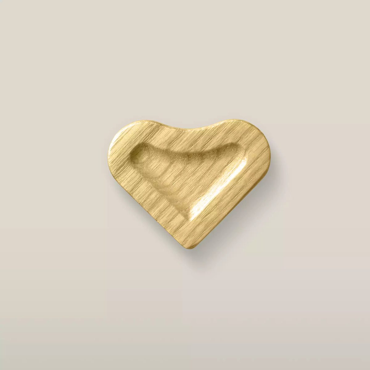 Solid ash scooped heart cabinet knob in the Cream finish, front view