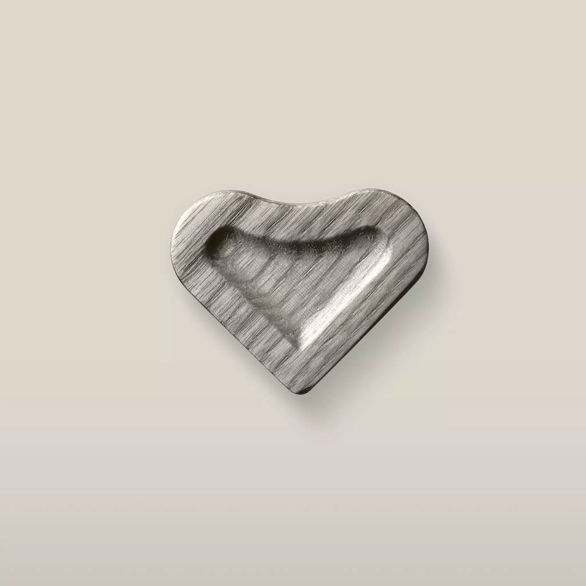 Solid ash scooped heart cabinet knob in the Dark Gray finish, front view