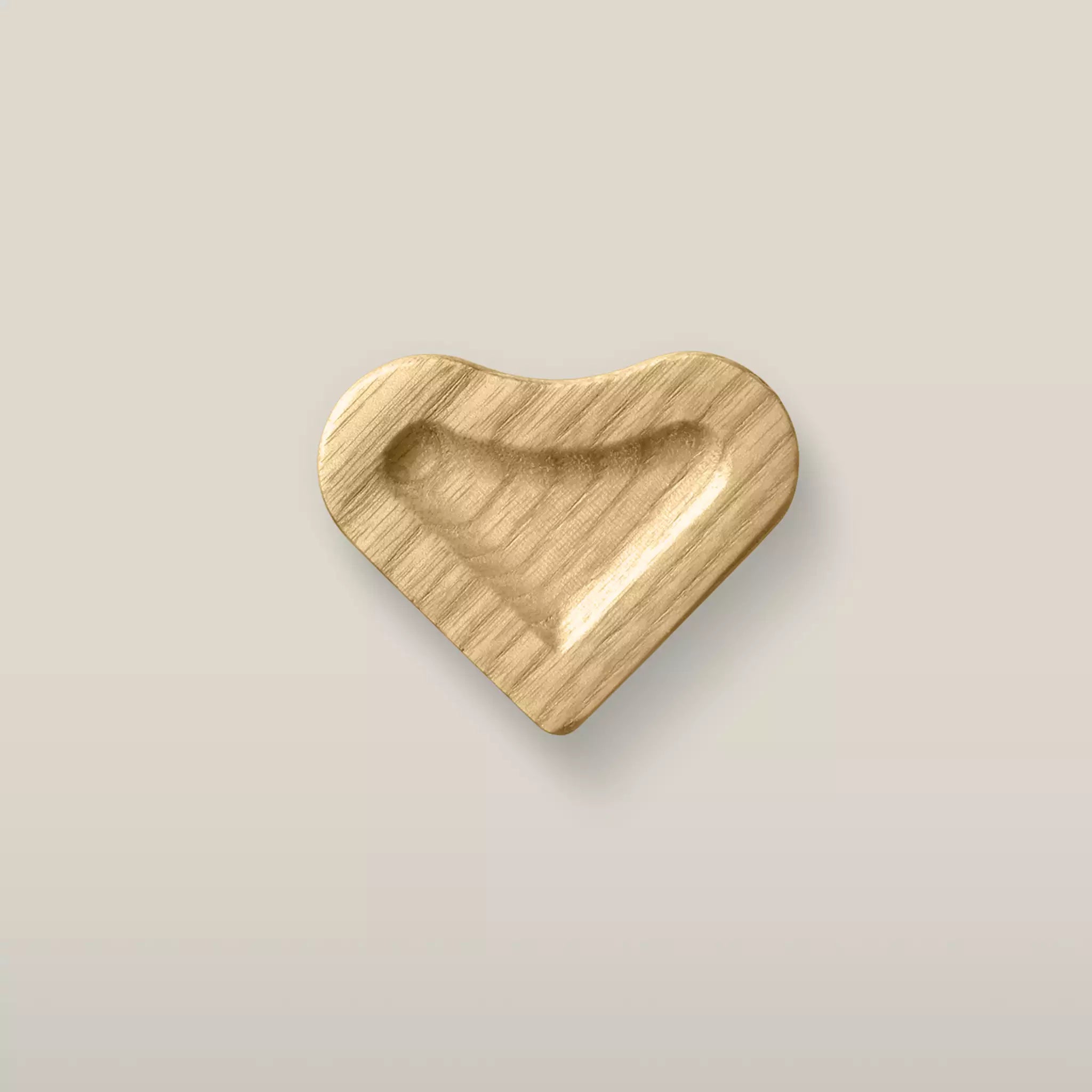 Solid ash scooped heart cabinet knob in the Oiled finish, front view