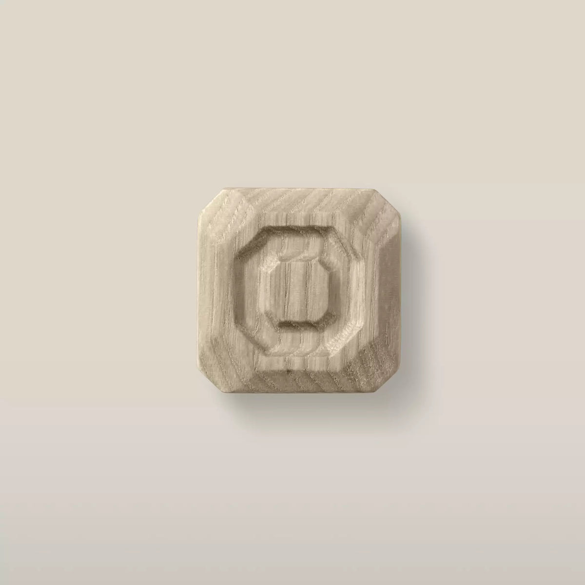 Solid ash stepped octagon cabinet knob in the Cappuccino finish, front view