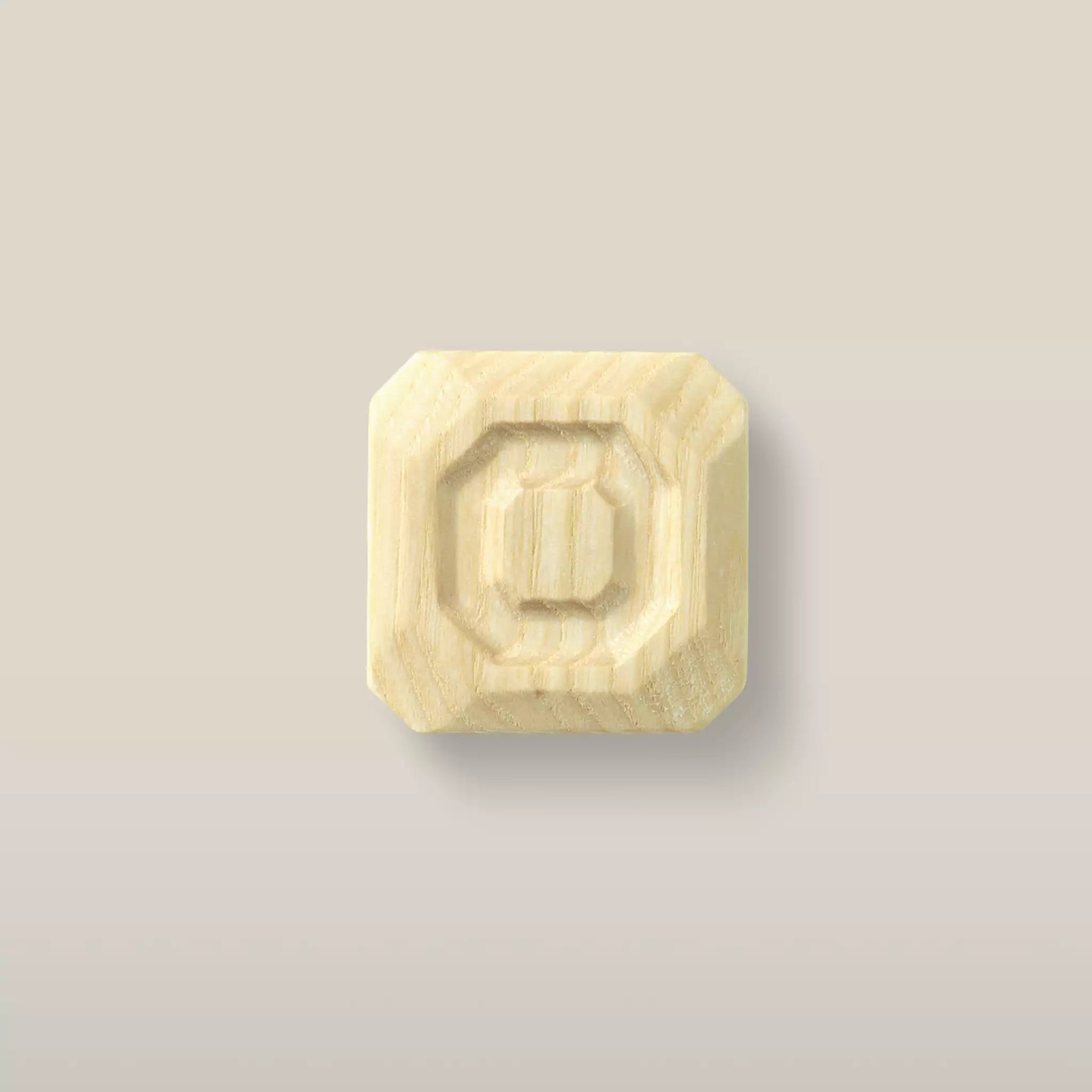 Solid ash stepped octagon cabinet knob in the Latte finish, front view