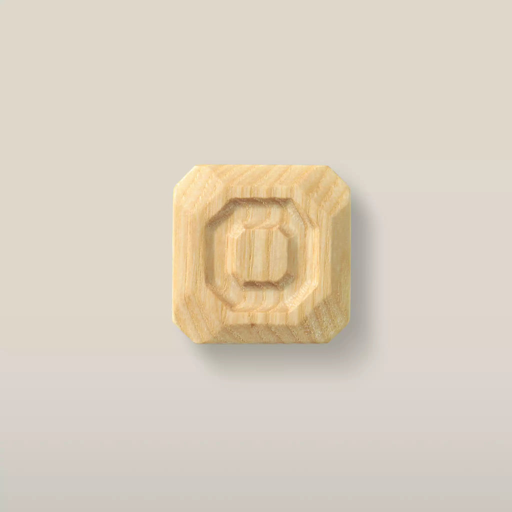 Solid ash stepped octagon cabinet knob in the Unfinished finish, front view