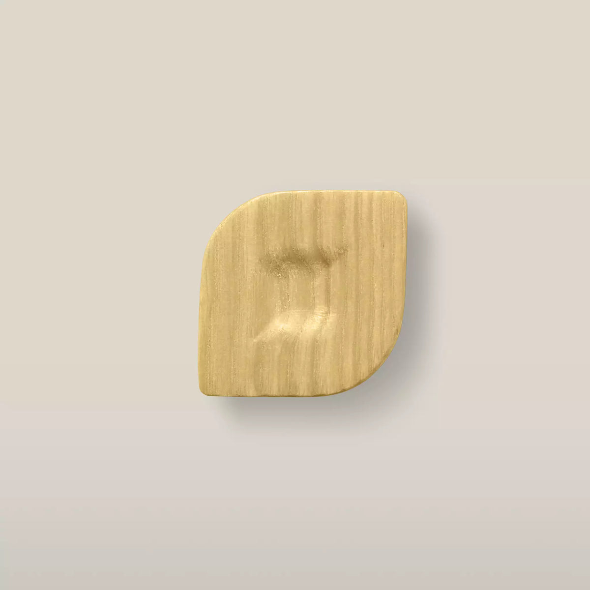 Solid ash twist cabinet knob in the Cream finish, front view