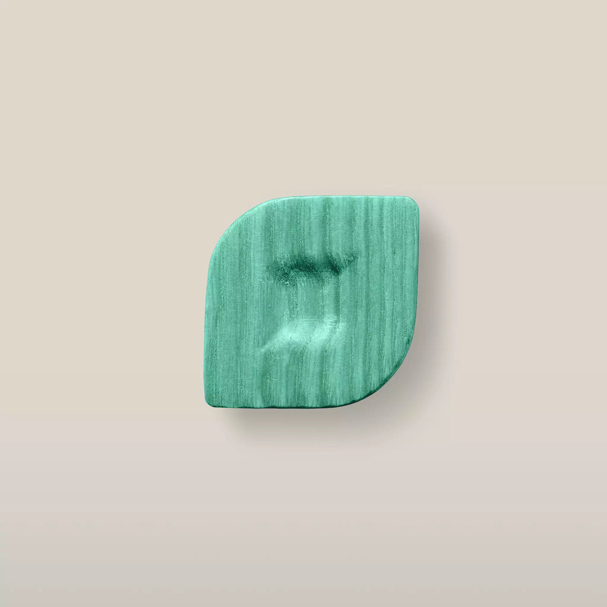 Solid ash twist cabinet knob in the Green finish, front view