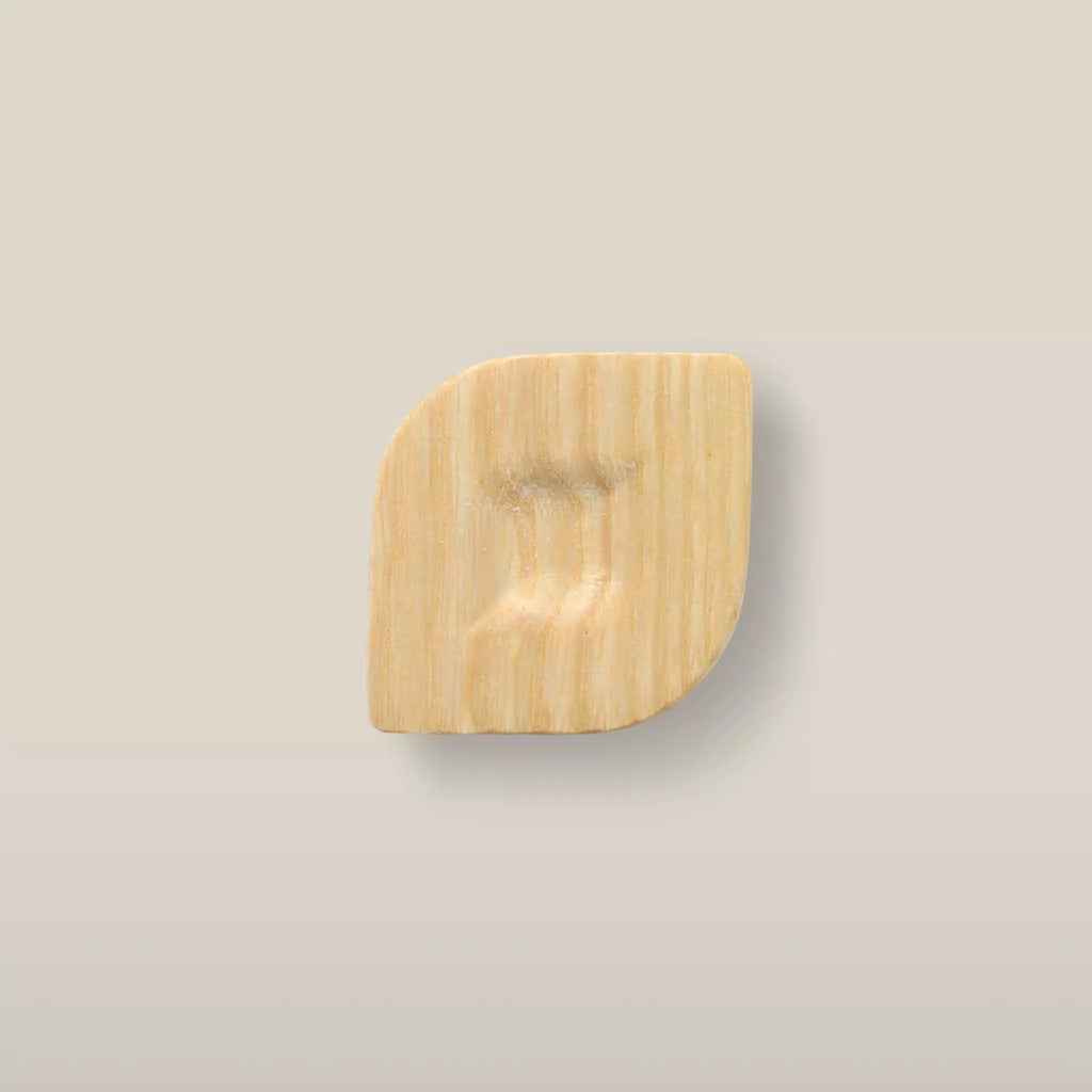 Solid ash twist cabinet knob in the Unfinished finish, front view