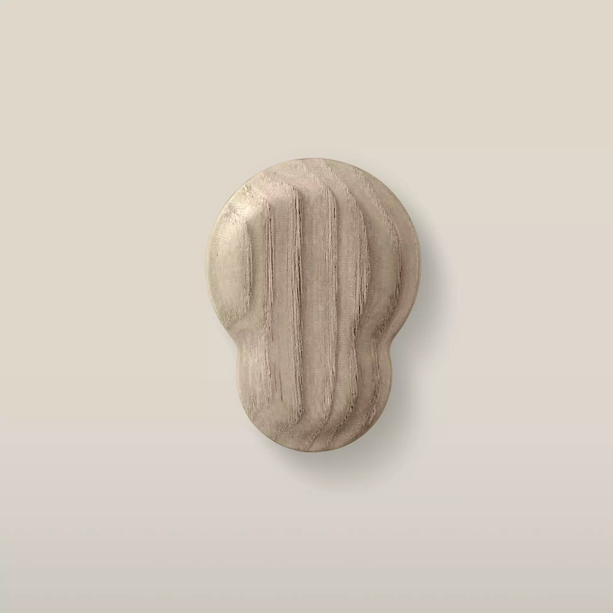 Solid ash fluted cabinet knob in the Cappuccino finish, front view