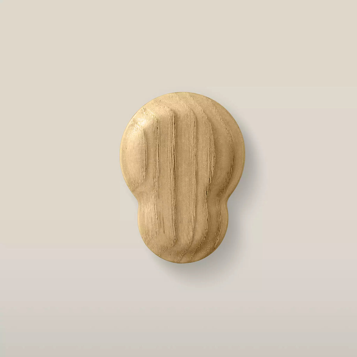 Solid ash fluted cabinet knob in the Oiled finish, front view