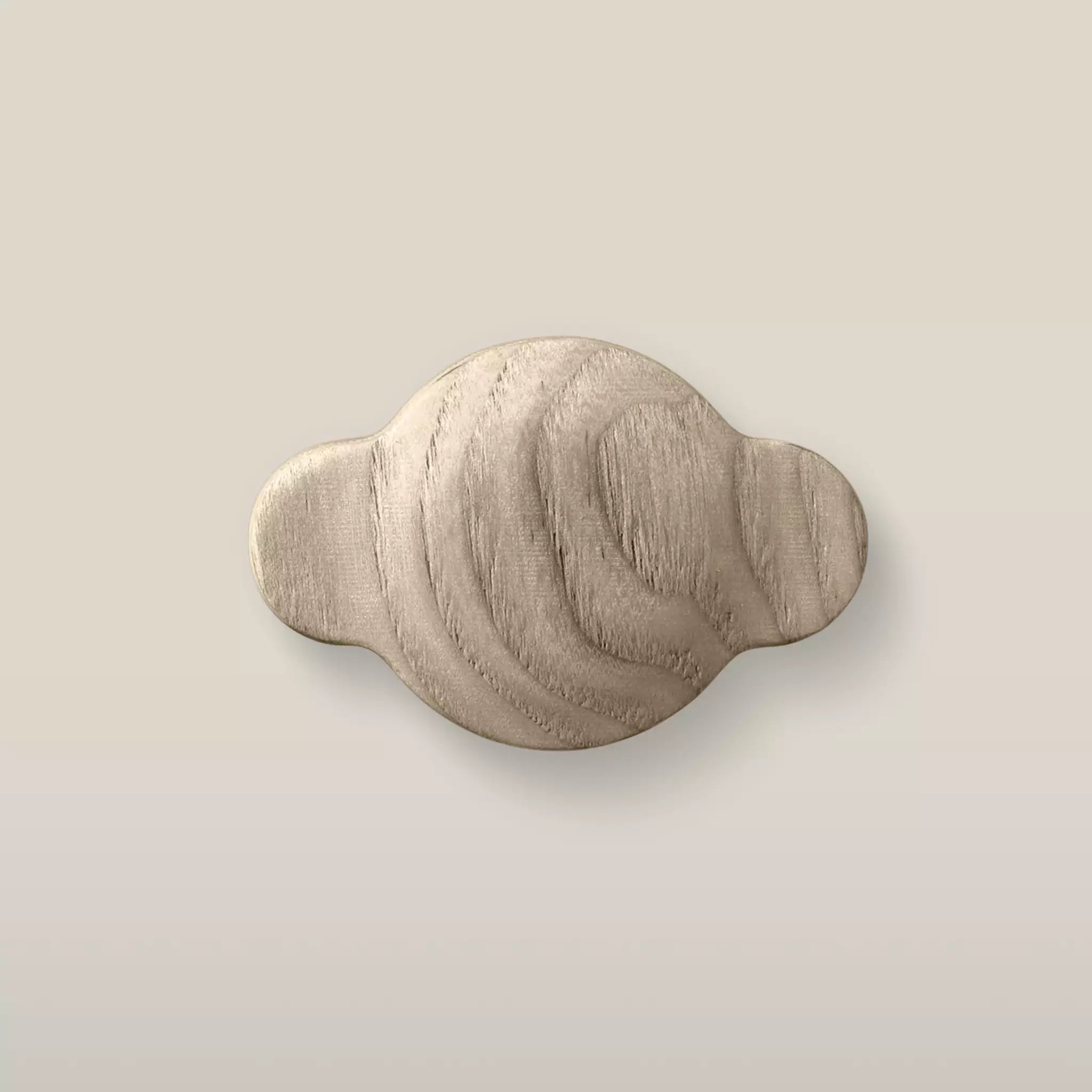 Solid ash wave cabinet knob in the Cappuccino finish, front view
