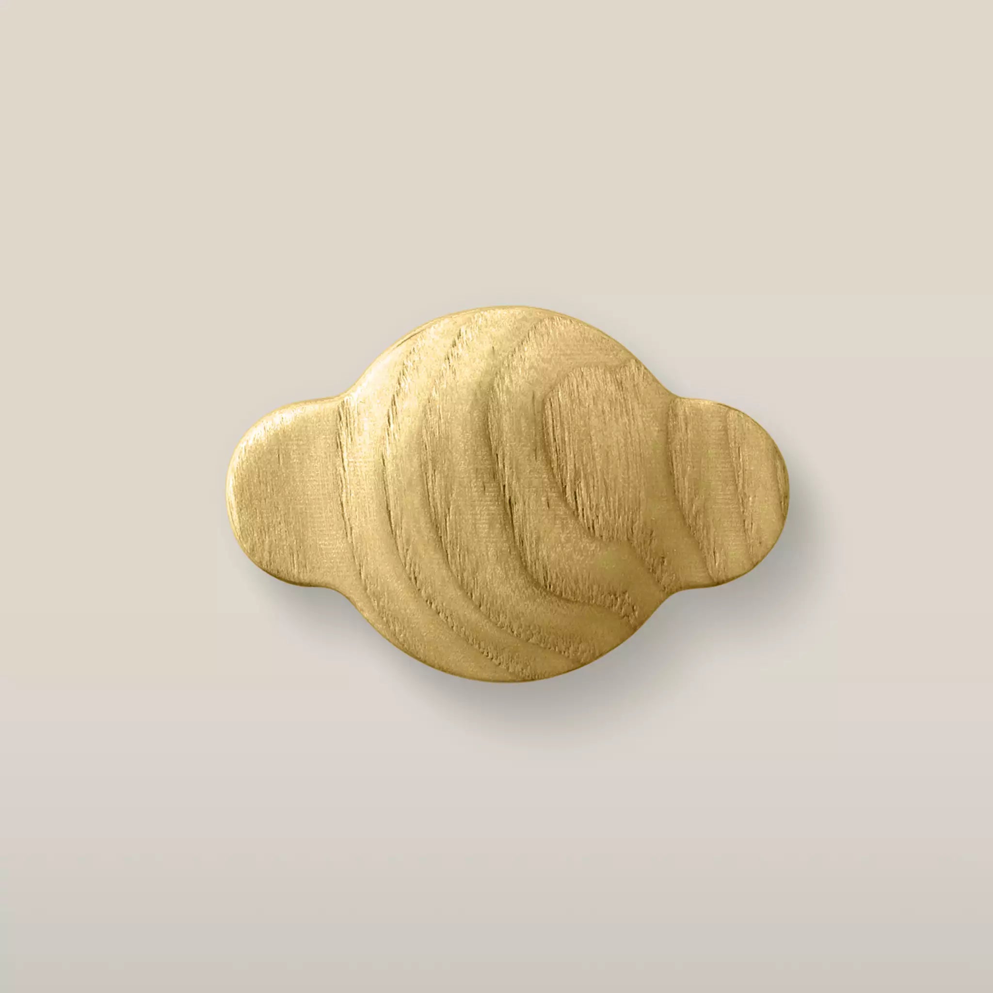Solid ash wave cabinet knob in the Cream finish, front view