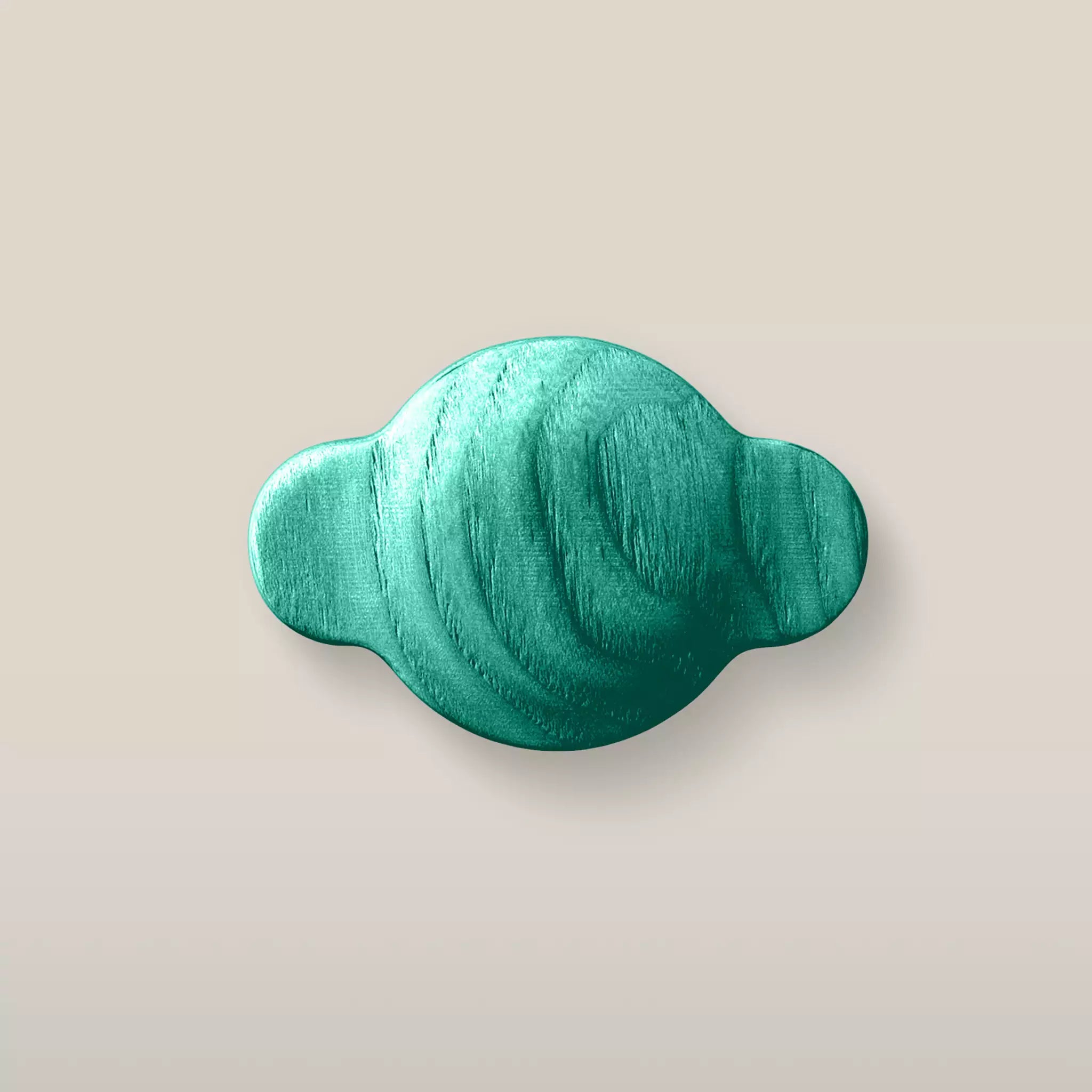 Solid ash wave cabinet knob in the Green finish, front view