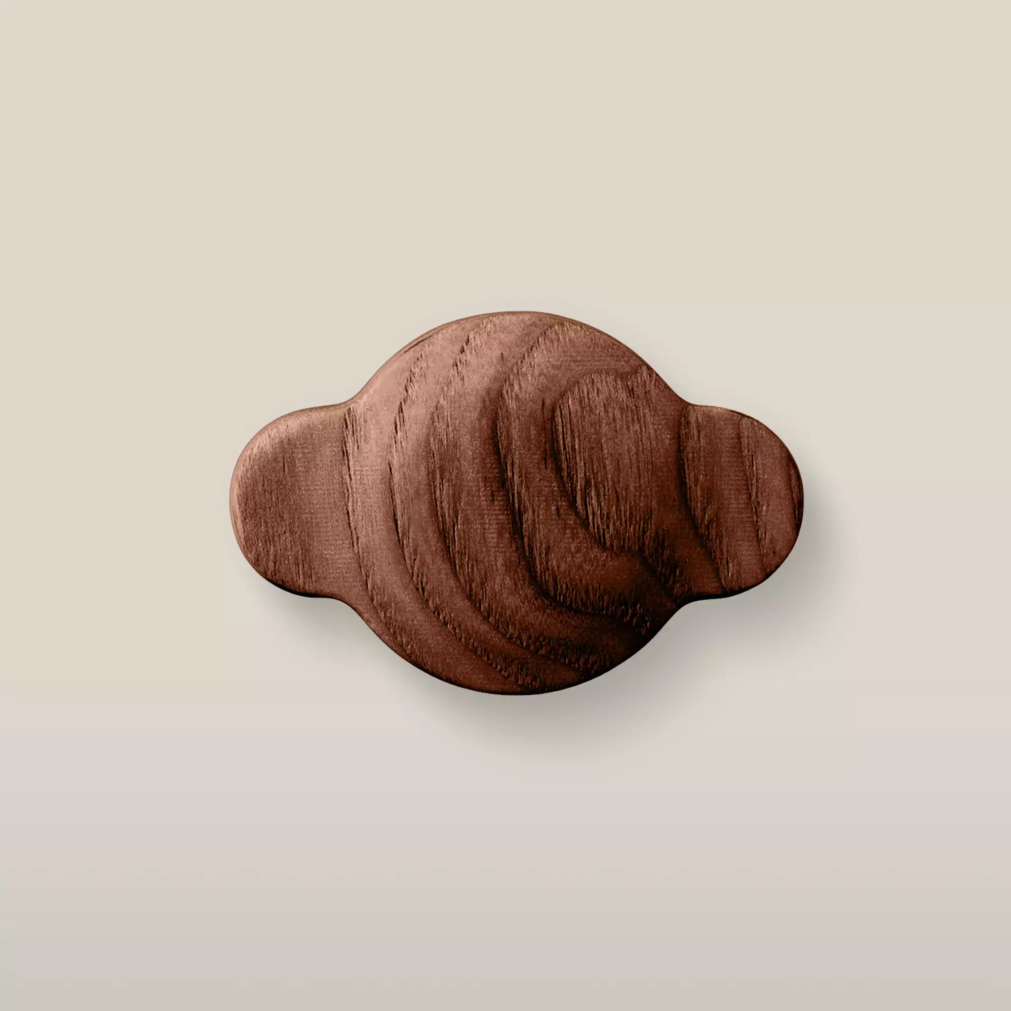 Solid ash wave cabinet knob in the Walnut finish, front view