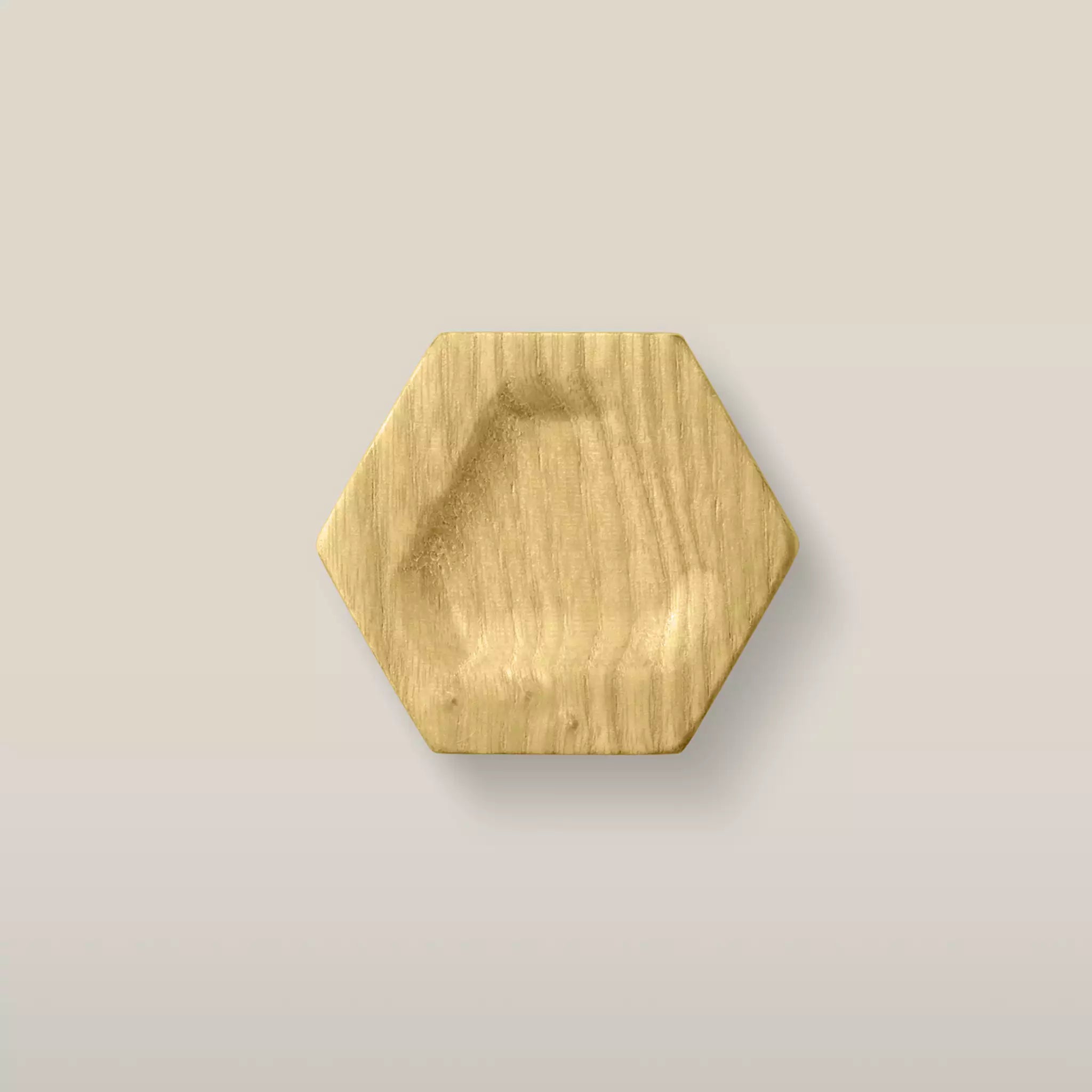 Solid ash carved hexagon cabinet knob in the Cream finish, front view