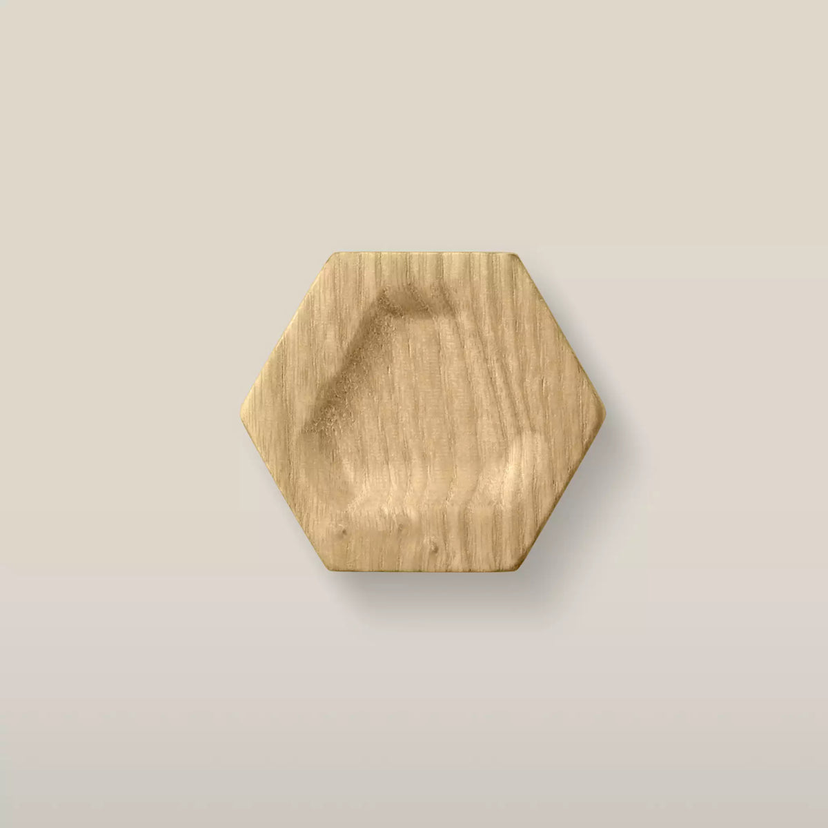 Solid ash carved hexagon cabinet knob in the Oiled finish, front view