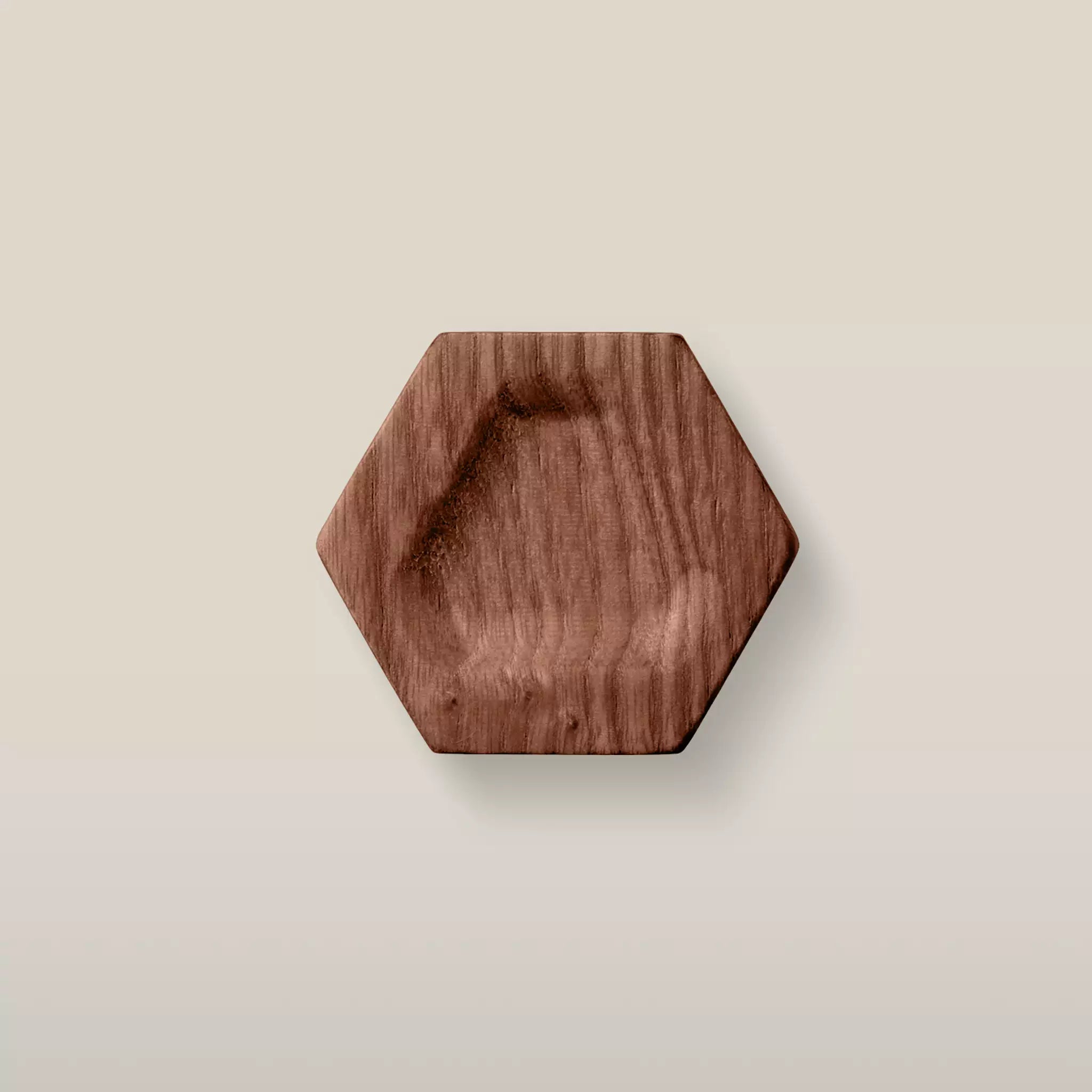 Solid ash carved hexagon cabinet knob in the Walnut finish, front view