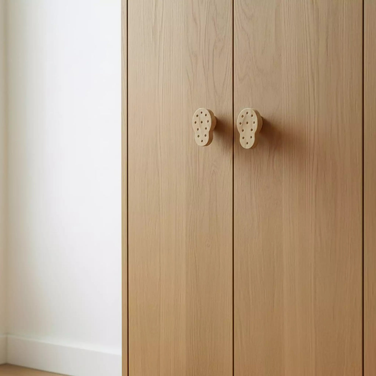 Solid ash dotted cabinet knob, front view