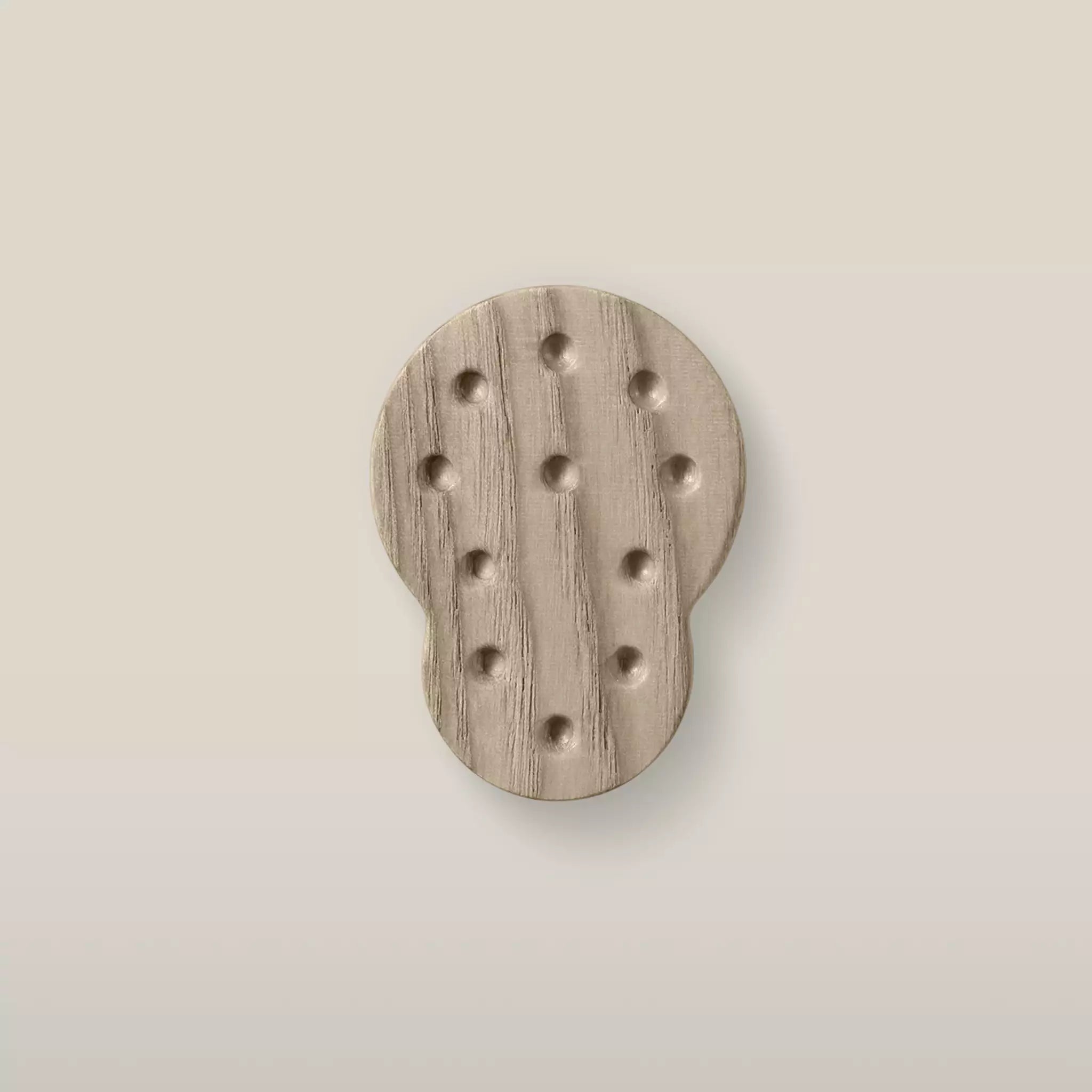 Solid ash dotted cabinet knob in the Cappuccino finish, front view