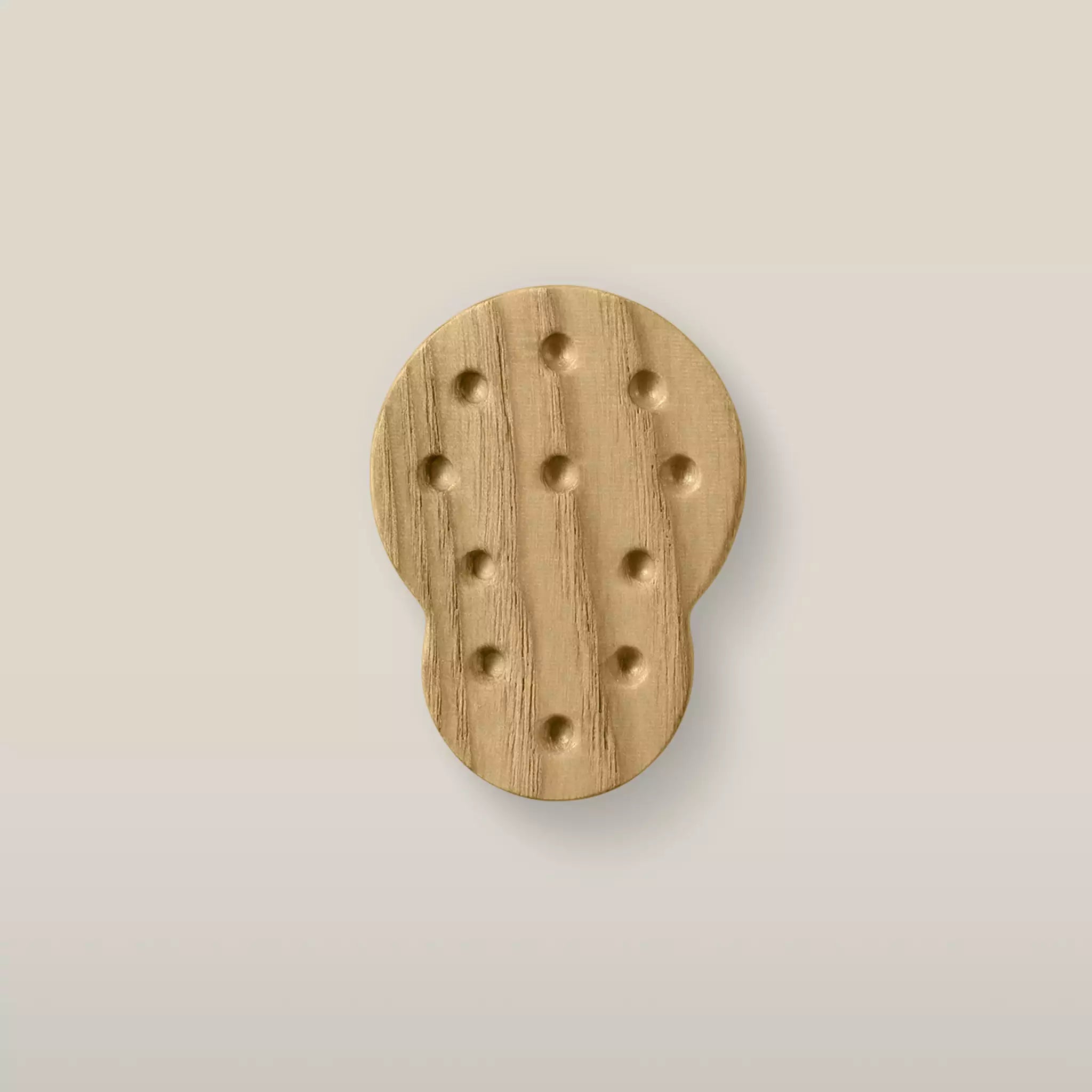 Solid ash dotted cabinet knob in the Oiled finish, front view