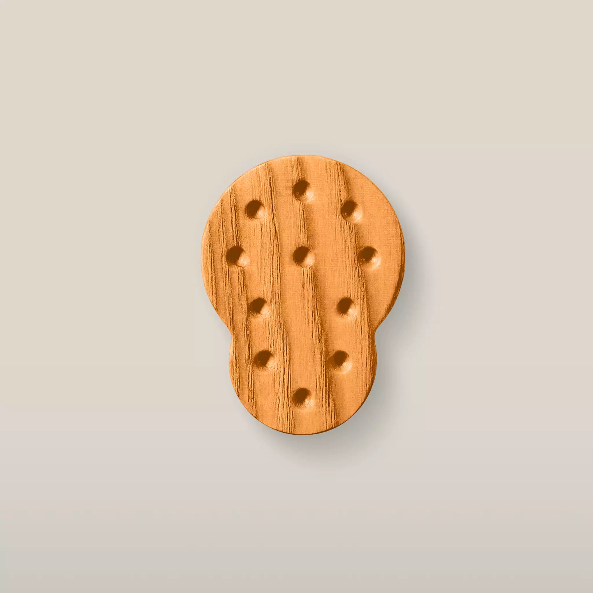Solid ash dotted cabinet knob in the Orange finish, front view