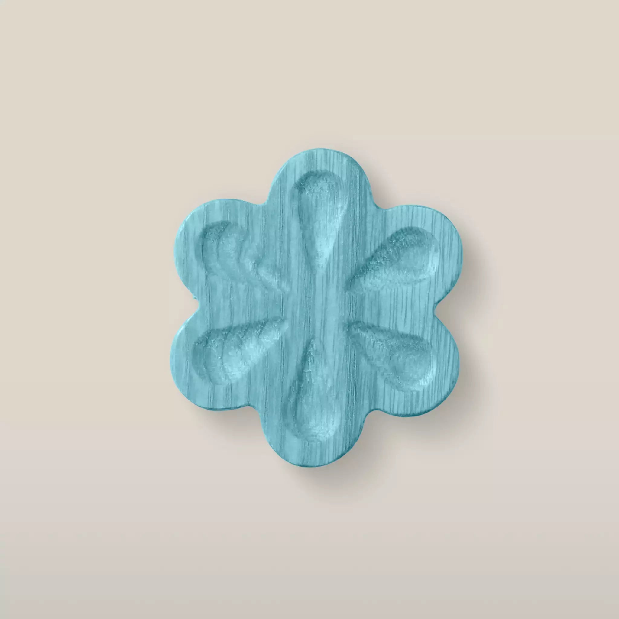 Solid ash carved flower cabinet knob in the Blue finish, front view
